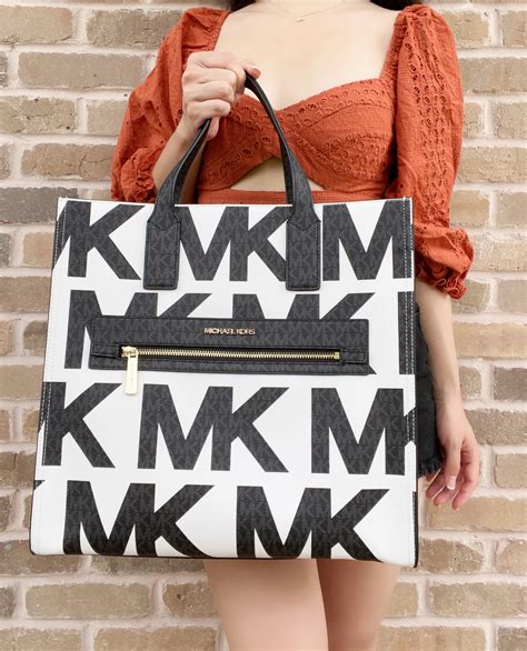 michael michael kors kenly large graphic logo tote bag|Michael Kors large signature tote.